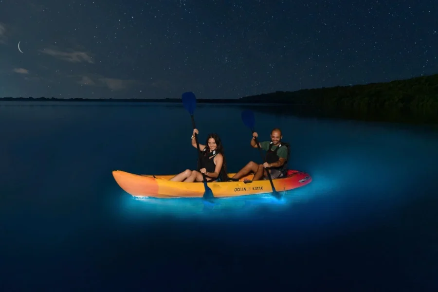 Pasenger doing kayak at night to see plankton in Lan Ha Bay Cruise 2 Days 1 Night