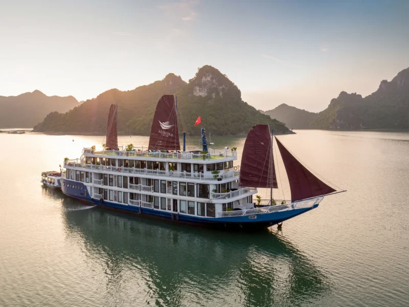 A boutique cruise sailing through limestone karsts - a key factor when choosing Lan Ha Bay vs Ha Long Bay.